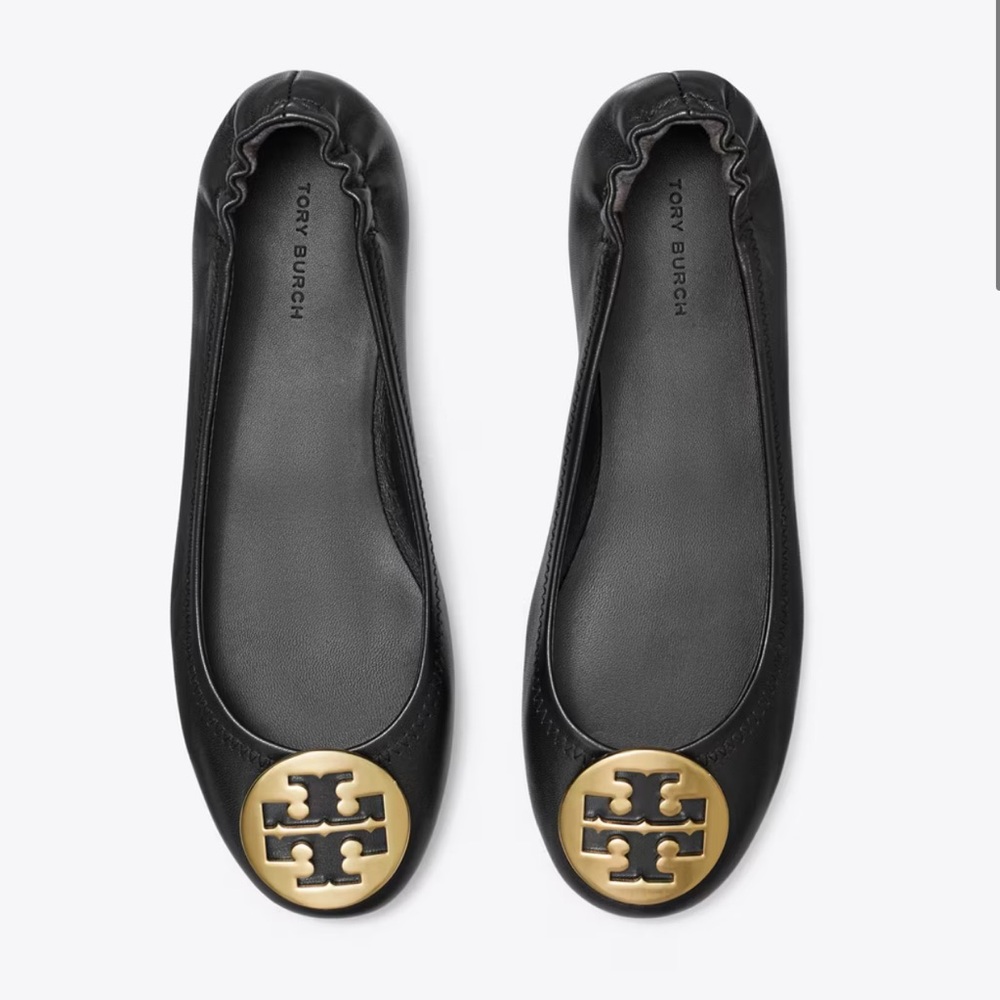 Tory Burch black leather classic flats. Size 7. Scuffing shown in image.